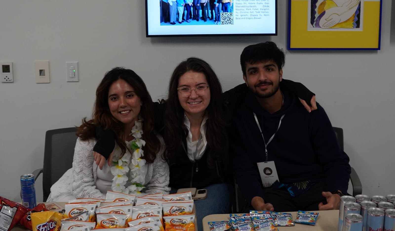 Members at a social with snacks