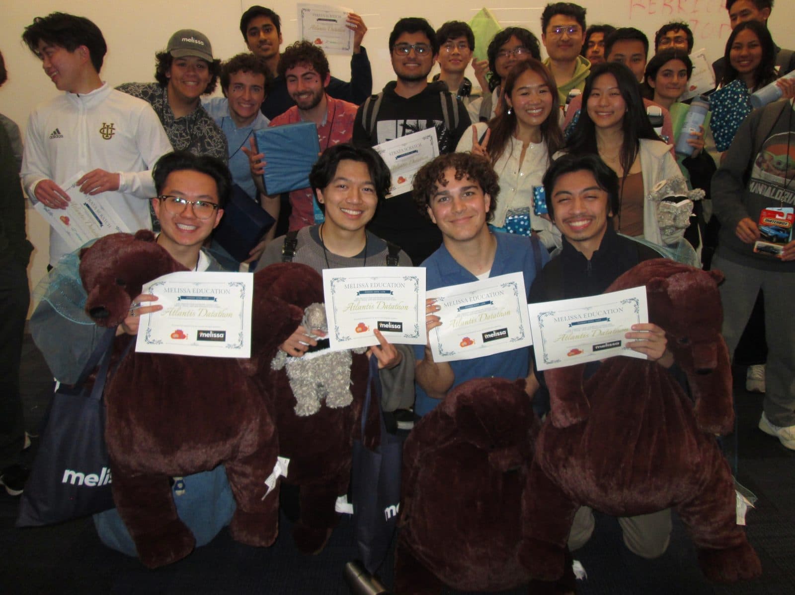 Datathon winners with the mascot