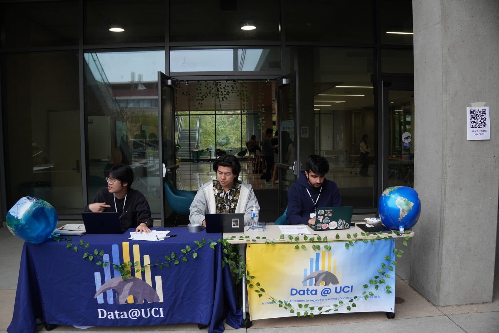 Data@UCI members tabling outside with laptops