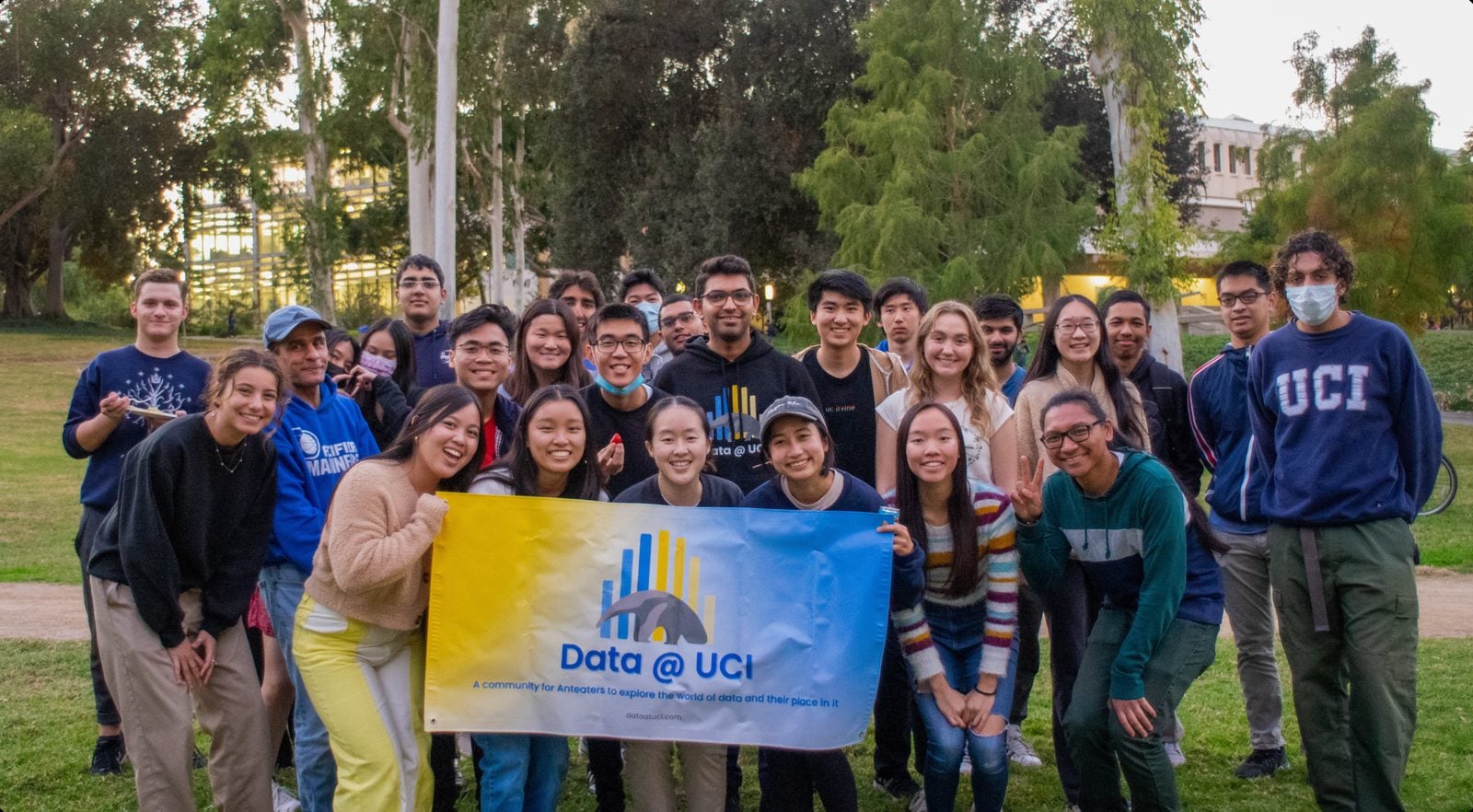 Data@UCI members with the club banner